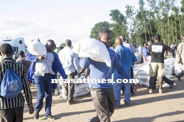 Bushiri in releif action, carries maize for donation doing God's work