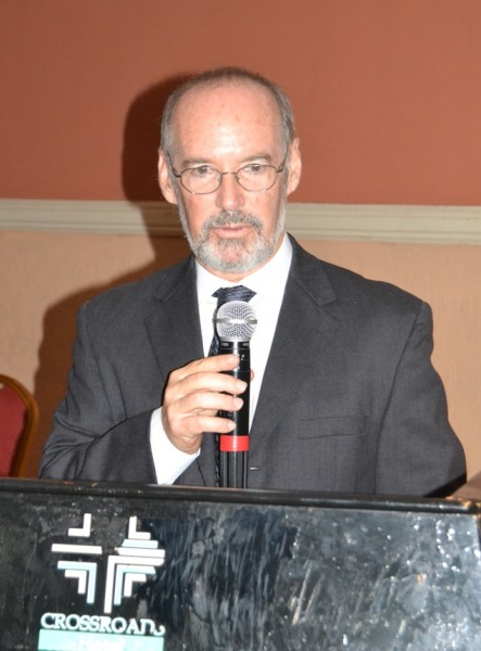 CARE Country Director, Michael Rewald gives his welcome remarks at Dissemination Programme of Muuni Wauchembere Wabwino at Crossroads Hotel-(c) Abel Ikiloni