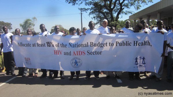 CSOs At the parliament holding the banner