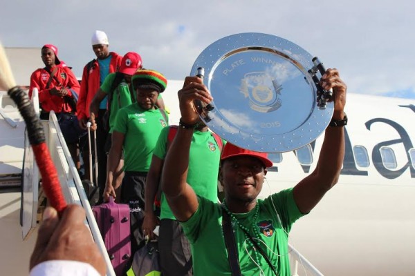 Captain Lucky Malata shows off the Cosafa Plate on arrival to a heroes' welcome for Malawi's footballers...Photo by FAM