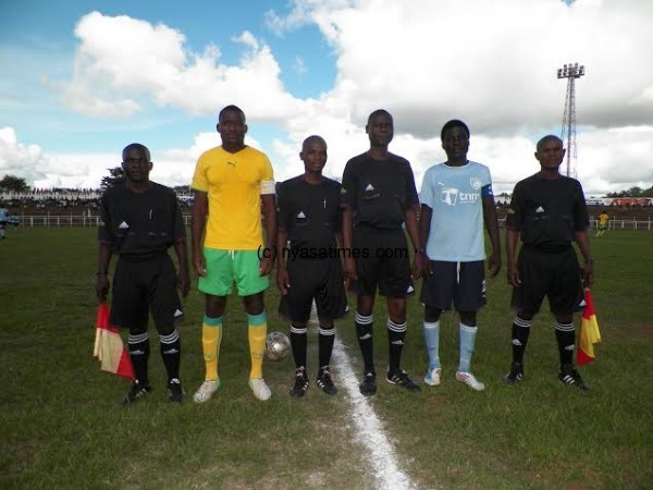 Captains Emmanuel Zoya, Sam Gunda pose with match officials before  the game