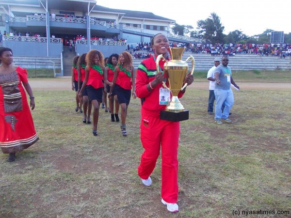 Caroline Ngwira on the way to handle the cup to the minister of Sports....Photo Jeromy Kadewere