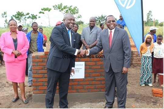 Standard Bank boss Mashanda (l) and Chitsime