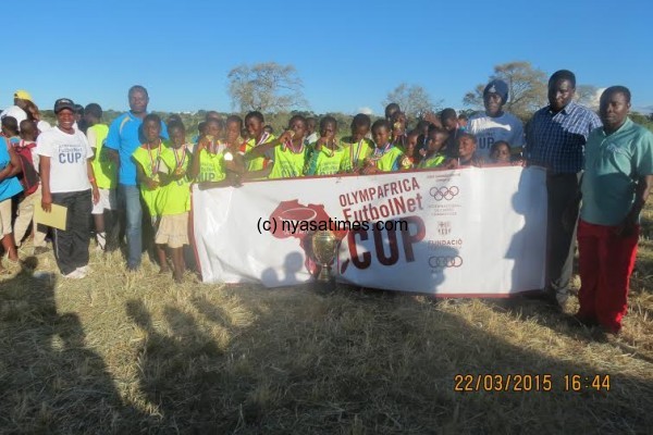 Champs Surestream pose with officials after receiving the cup