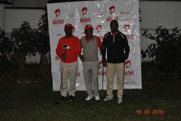 Charles Kamoto Airtel MD posing a photo with some golfers before teeing off