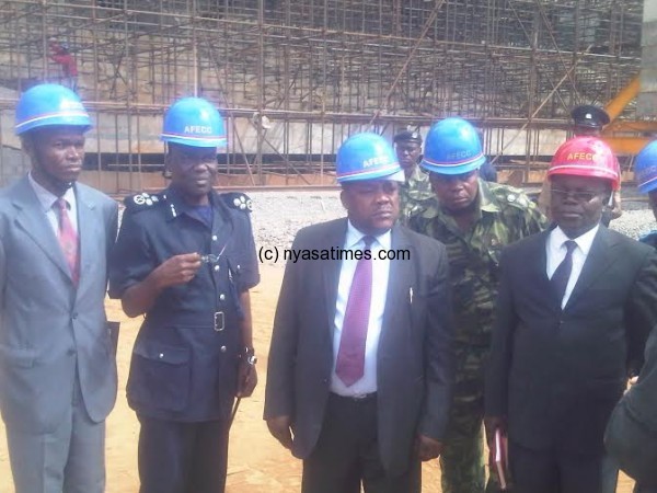 Chibingu and Police chief Dzonzi  inspect the national stadium