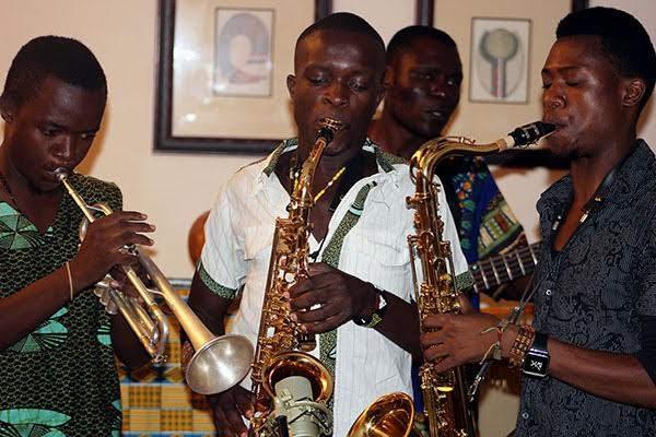 Chigo (centre) and the other two saxophonists at work