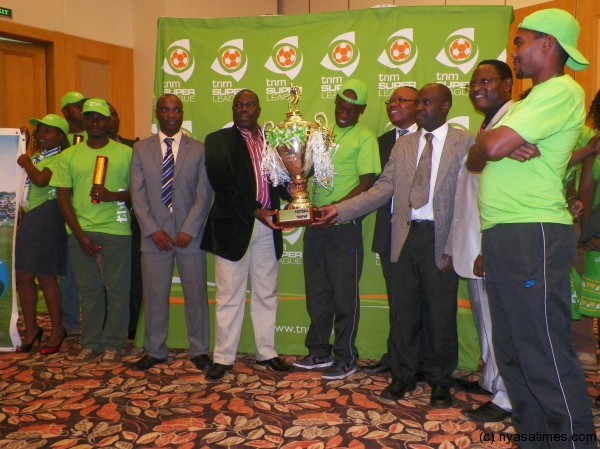 Chihana presents trophy to Silver capt Peter Pindani.-Photo by Paul Mutharike/Nyasa Times