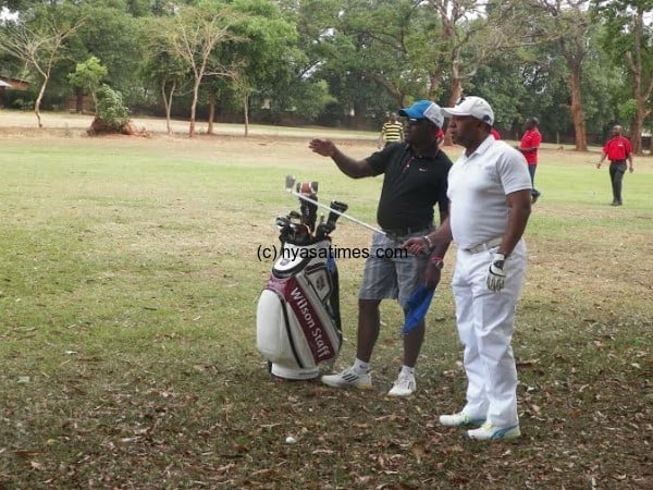 Chilima gets tips from his caddy Chris Kachiguma