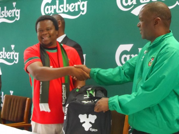 Chimodzi and Kondowe admiring the bag