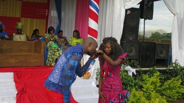 Chipuwa kisses the engagement ring on Dinna's fingure.Pic by Jeromy Kadewere, Nyasa Times