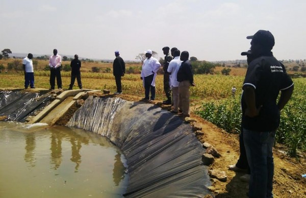 Chiyembekeza admiring to one of the dams being used at Thyolansanu farm - pic by Gladys Kamakanda