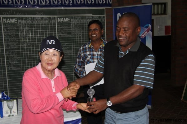 Cho receiving a prize during National Bank golf tourney at LGC in August this year.