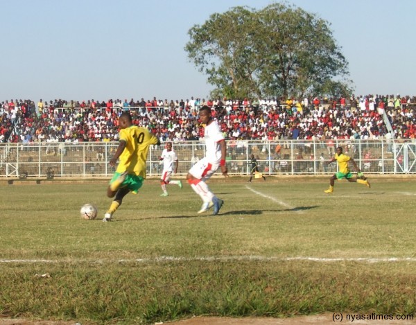 Civo midfielder Dave Ng'ambi with the ball being challenged by Sankhani Mkandawire