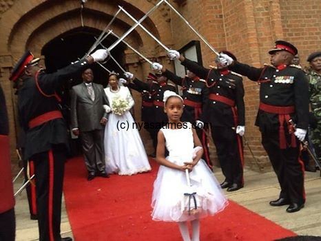 The flower girl leads State wedding