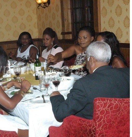The former pageants enjoying their dinner with Bhima (foreground)