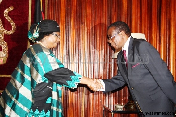 President Banda pays heartfelt condolences to family after sudden death of Justice Mbendera (right)