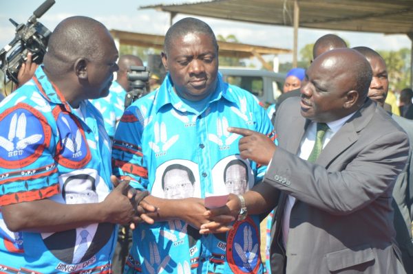 DPP officials,Vincent Ghambi,Keneth Sanga (C) and Vuwa Kaunda: Confirm the parry ferried supporters to political rally on government vehicles