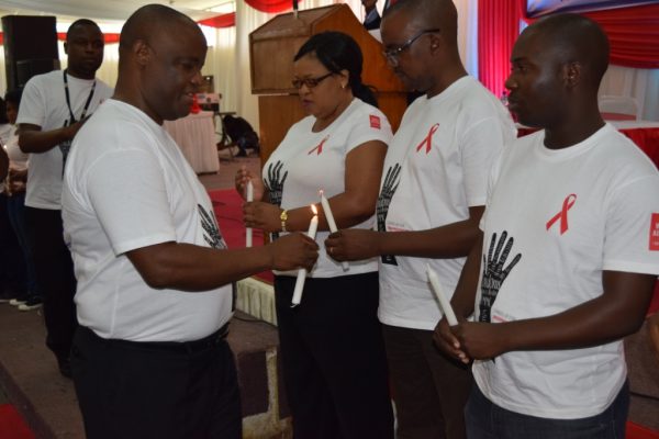 Press staff marking World Aids Day with a Candle Lighting 