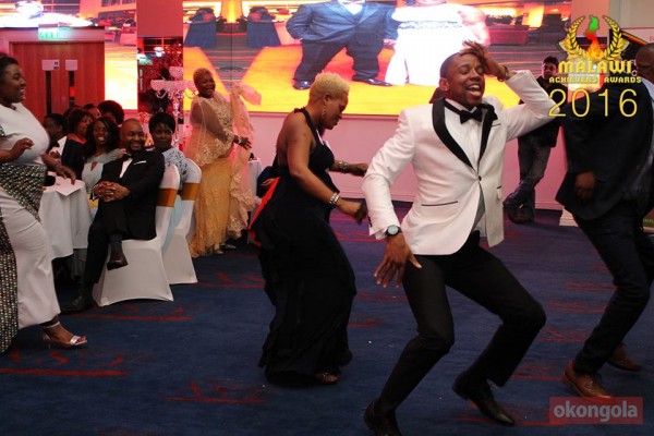 Dancing antics, Richard Gondwe leads Miss Malawi UK organisers to collect awards