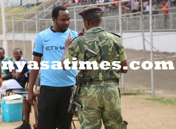 Dedza Young Soccer official exchanging bitter words with security man... .Photo Jeromy Kadewere