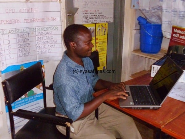 he Deputy Headteacher at Mpeni working on the donated laptop.  Pic by James Mitengo