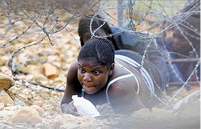 Desperate lives ... a woman flee across the South African border