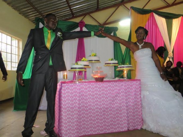 Dickson & Chifundo pose after cutting the cake