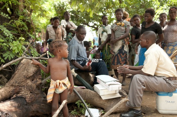 Displaced villagers at Sekeni 1 camp in Chikwawa district queue to get medical assistance.