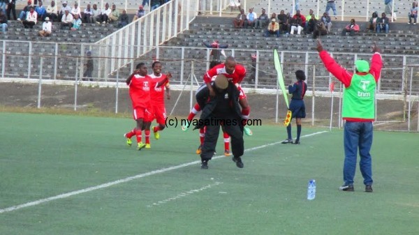 Diverson Mlozi celebrating his goal with team manager Billy Tewesa....Photo Jeromy Kadewere