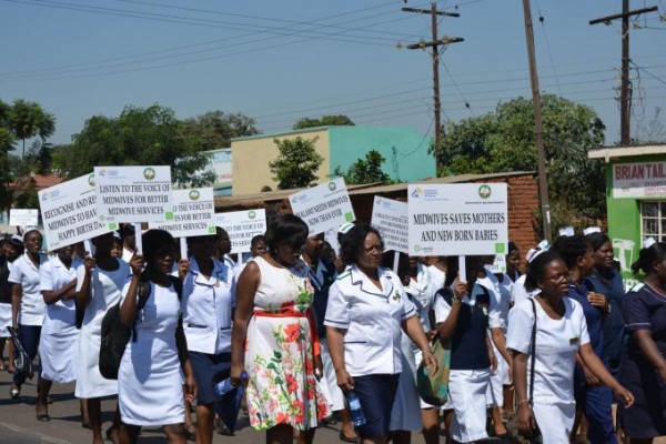 Dr Ann Phoya, President of Association of Malawian Midwives joins the procession, photo taken by Collins Mhango, Save the Children