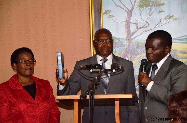 Dr. James Munthali takes oath of office and allegiance as new Agriculture and Food Security Minister at Kamuzu Palace on Wednesday July 3, 2013