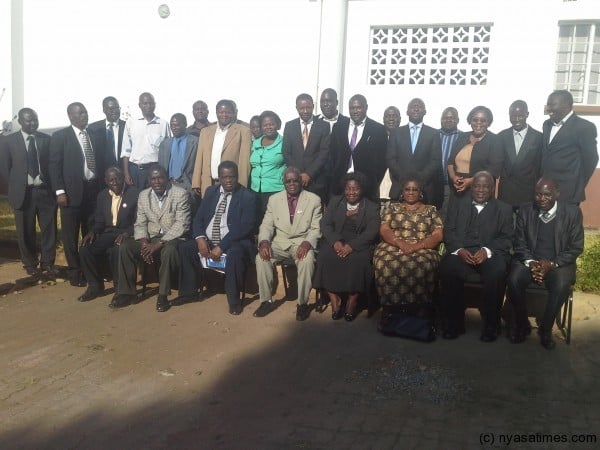 Dr. Munthali poses in group photo with some of the aggregators' committee members