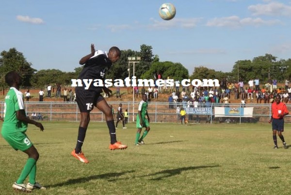 Eagles' Gilbert Chirwa makes a clearance during the game