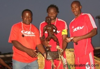 Ng'onamo and Bullets players showing the GOtv challenge cup