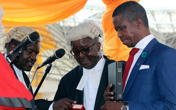 The Patriotic Front's Edgar Lungu, right, is sworn in as president at an inauguration ceremony in Lusaka Photo: AP