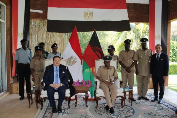 Egyptian Ambassador Maher El -Adawy pose with the police officers.
