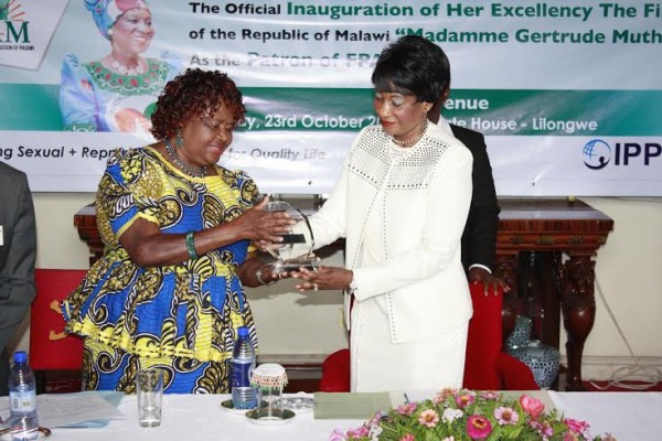 FPAM chairperson Ng'oma presents to First Lady a patron symbol