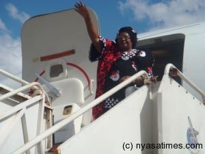JB waving when she left the country