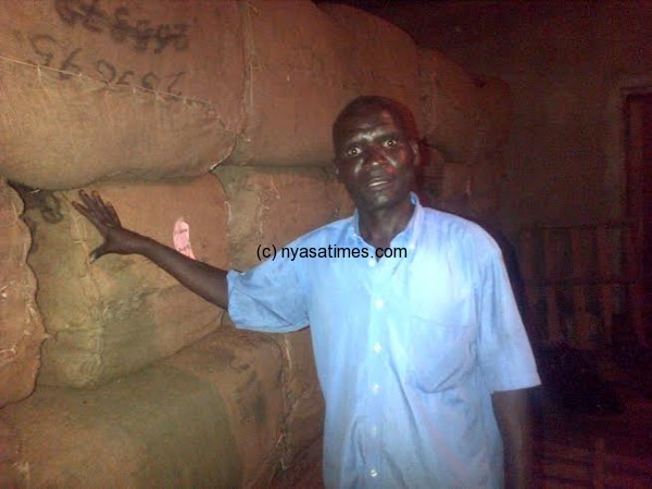 Farmer with his bales of tobacco