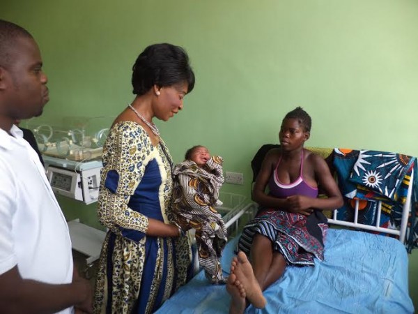 First Lady Madame Gertrude Mutharika admires a newly born baby boy at Monkey Bay Hospital on Christmas. Pic Arnold Namanja (MANA)