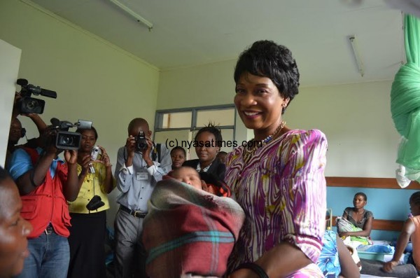 First Lady holds a newly born baby at Chisoka health clinic in Thyolo