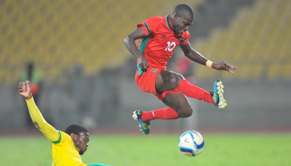 John Banda of Malawi tackled by Motjeka Madisha of South Africa during the 2015 Cosafa Cup Plate Semi Finals match between South Africa and Malawi at Royal Bafokeng Stadium, Rustenburg on the 27 May 2015  ©Muzi Ntombela/BackpagePix