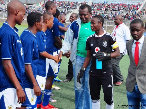 Football Association of Malawi officials Casper Jangale and Gomezgani Zakazaka giving players fair play greetings....Photo Jeromy Kadewere