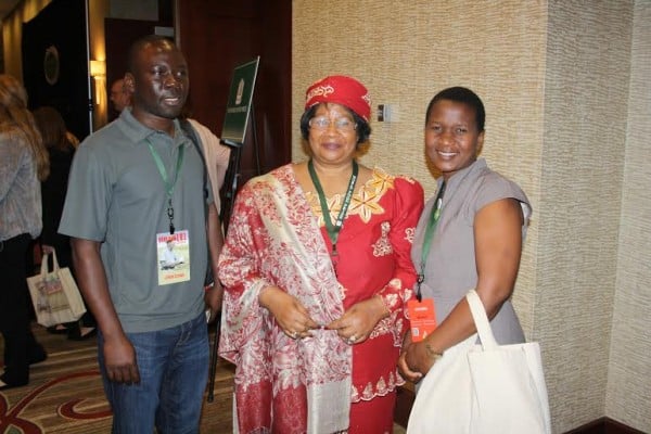 Former president Banda poses for a photograph with a Bunda College of Agriculture PhD student in the US and and ICRASAT official (right) based at Chitedze Research Station