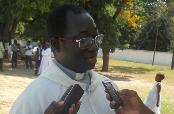 Fr. Nkhata speaking to the media during the Labour Day celebrations at St. Augustine Cathedral Parish in Mangochi. Pic Arnold Namanja (MANA)