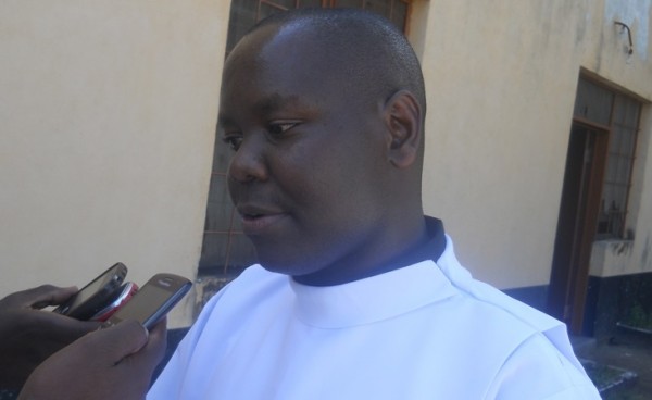 Fr. Sichinga talking to the media on the activities to mark Labour Day. Pic Arnold Namanja (MANA)