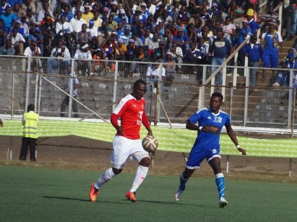 Francis Mlimbika chasing Bullets striker Chiukepo Msowoya with the ball...Photo Jeromy Kadewere.