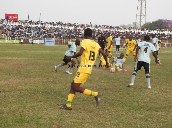 Frank Banda tackles a Civo player, Pic Alex Mwazalumo