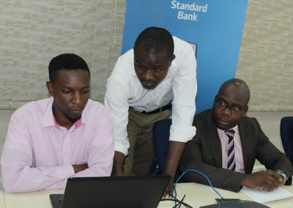 Galaxy FM journalist Dickson Gondwe doing the draw while Kazima looks on